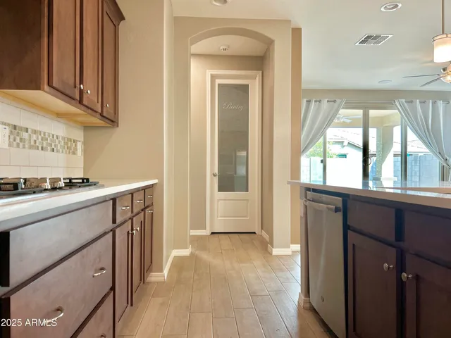 a view of washer and dryer with a kitchen
