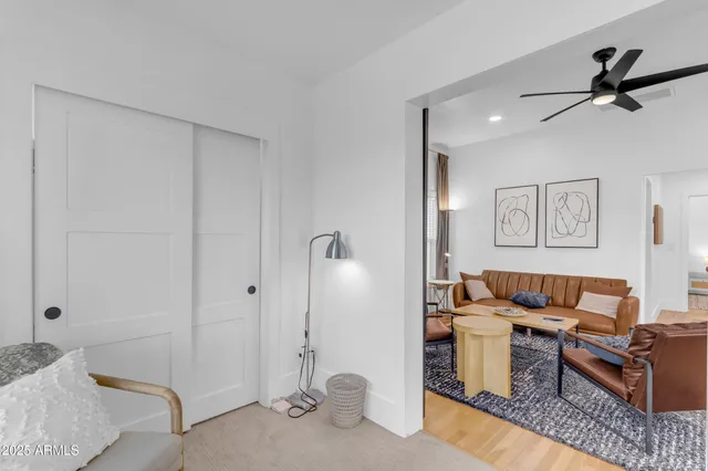 a bedroom with a bed and glass windows