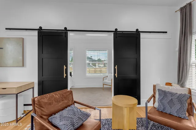 a living room with furniture and a rug