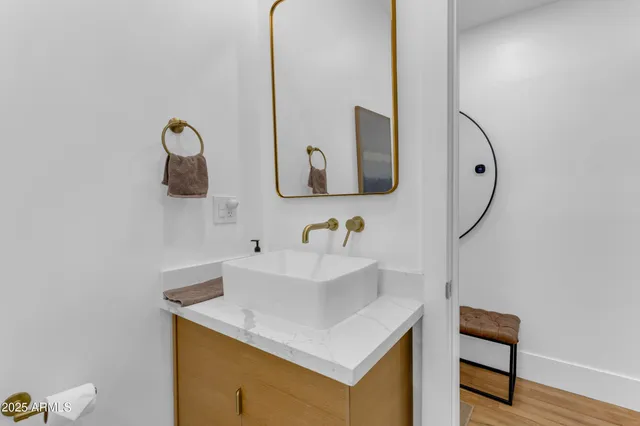 a bathroom with a sink and a mirror