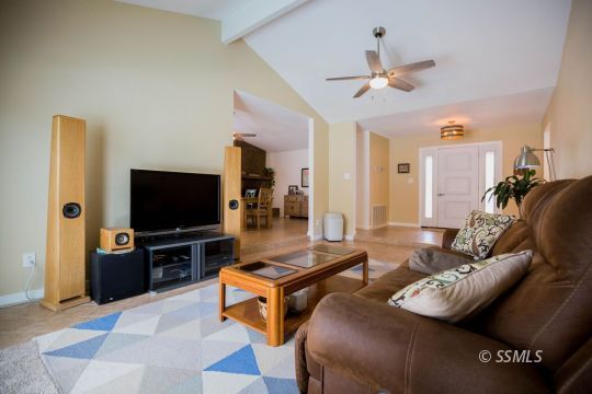 737 Peg Street Ridgecrest, CA 93555 - Photo 9 of 43 a living room with furniture and a flat screen tv