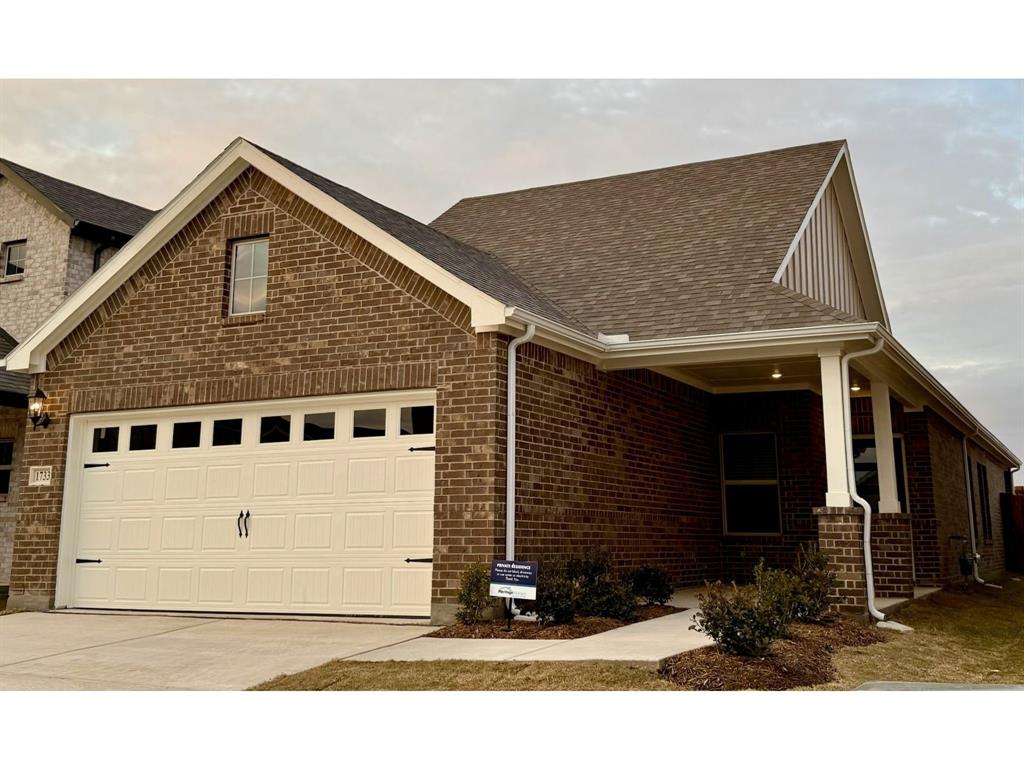 a view of house with garage