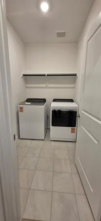 a utility room with washer and dryer