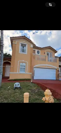 a view of front door and small yard