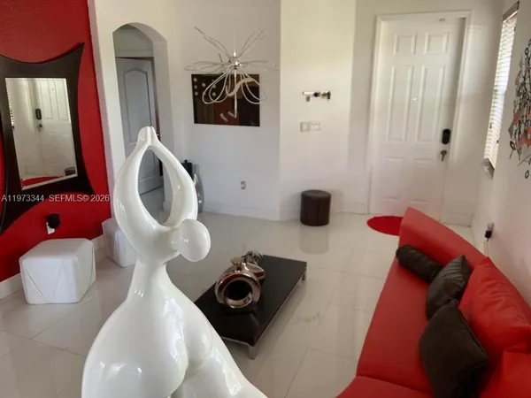 a kitchen with stainless steel appliances kitchen island granite countertop a sink a stove and chairs