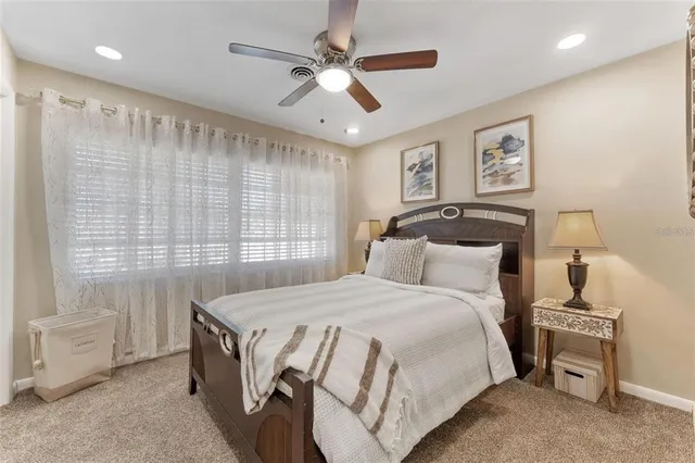 a spacious bedroom with a bed and a table