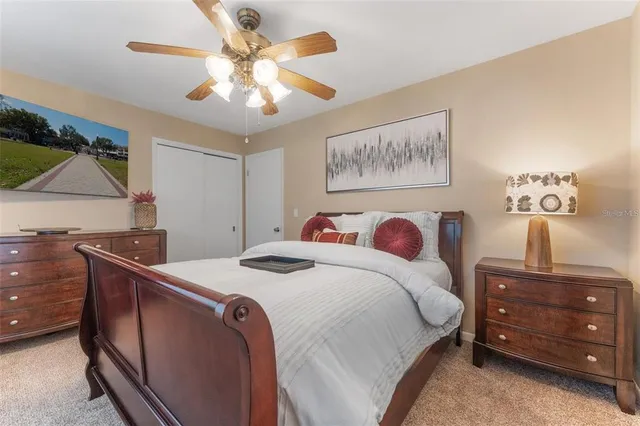 a bed room with a bed and a dresser