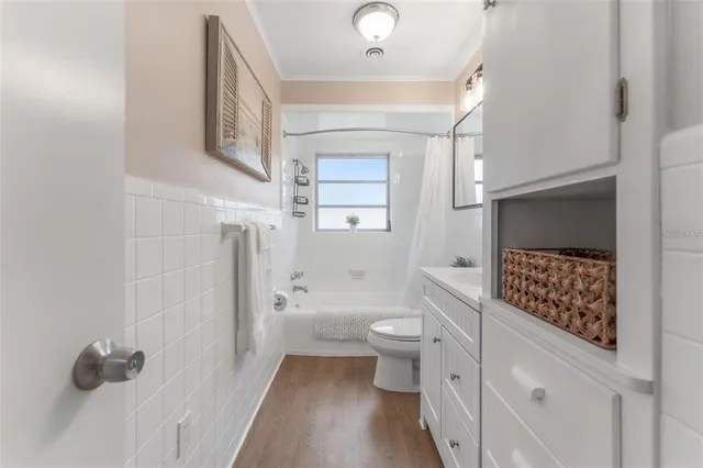a bathroom with a toilet sink and shower