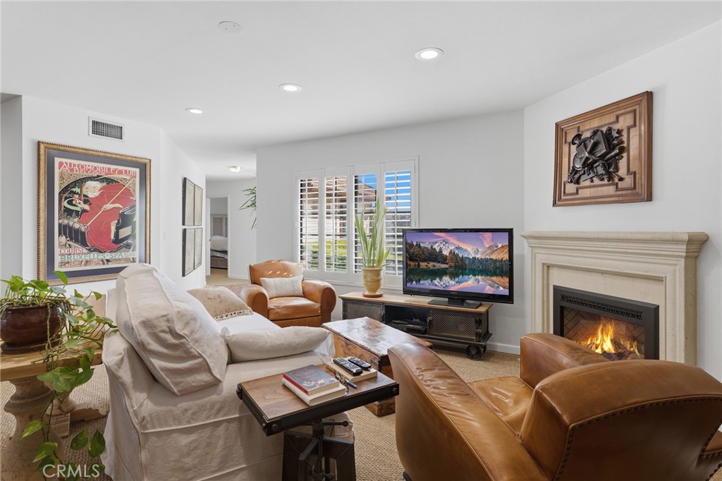 27843 Parker Road Castaic, CA 91384 - Photo 14 of 61 a living room with furniture a flat screen tv and a fireplace