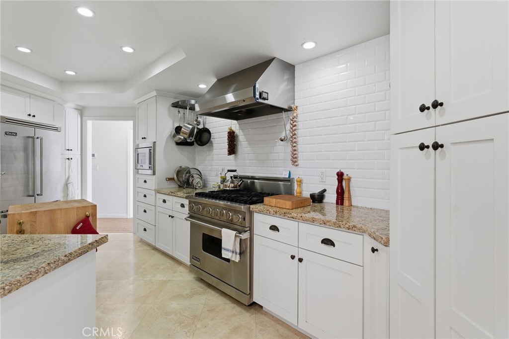 27843 Parker Road Castaic, CA 91384 - Photo 19 of 61 a kitchen with stainless steel appliances granite countertop a sink stove and refrigerator