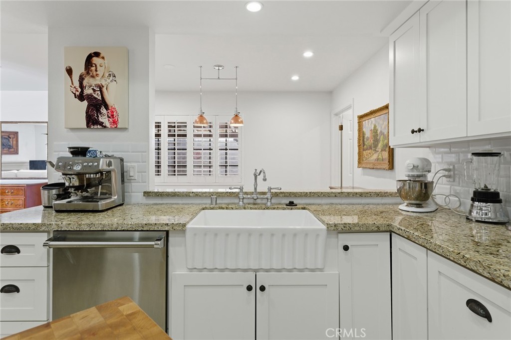 27843 Parker Road Castaic, CA 91384 - Photo 22 of 61 a kitchen with granite countertop stainless steel appliances a sink stove top oven and cabinets