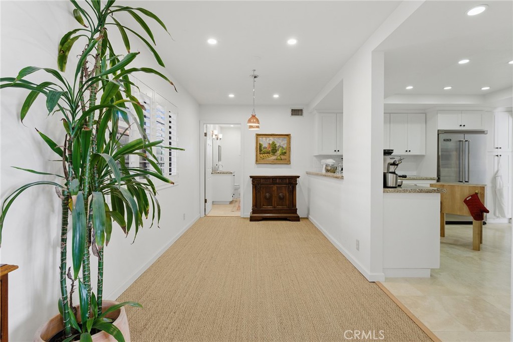 27843 Parker Road Castaic, CA 91384 - Photo 25 of 61 a view of a hallway with floor to ceiling window and potted plants