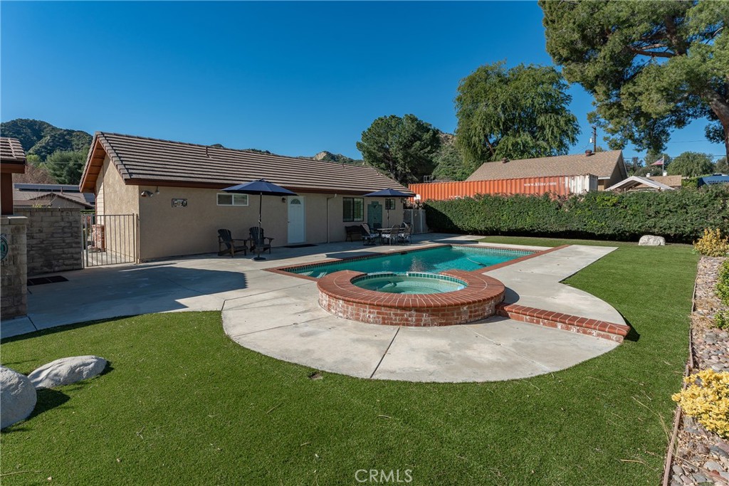 27843 Parker Road Castaic, CA 91384 - Photo 46 of 61 a view of a house with swimming pool and a yard