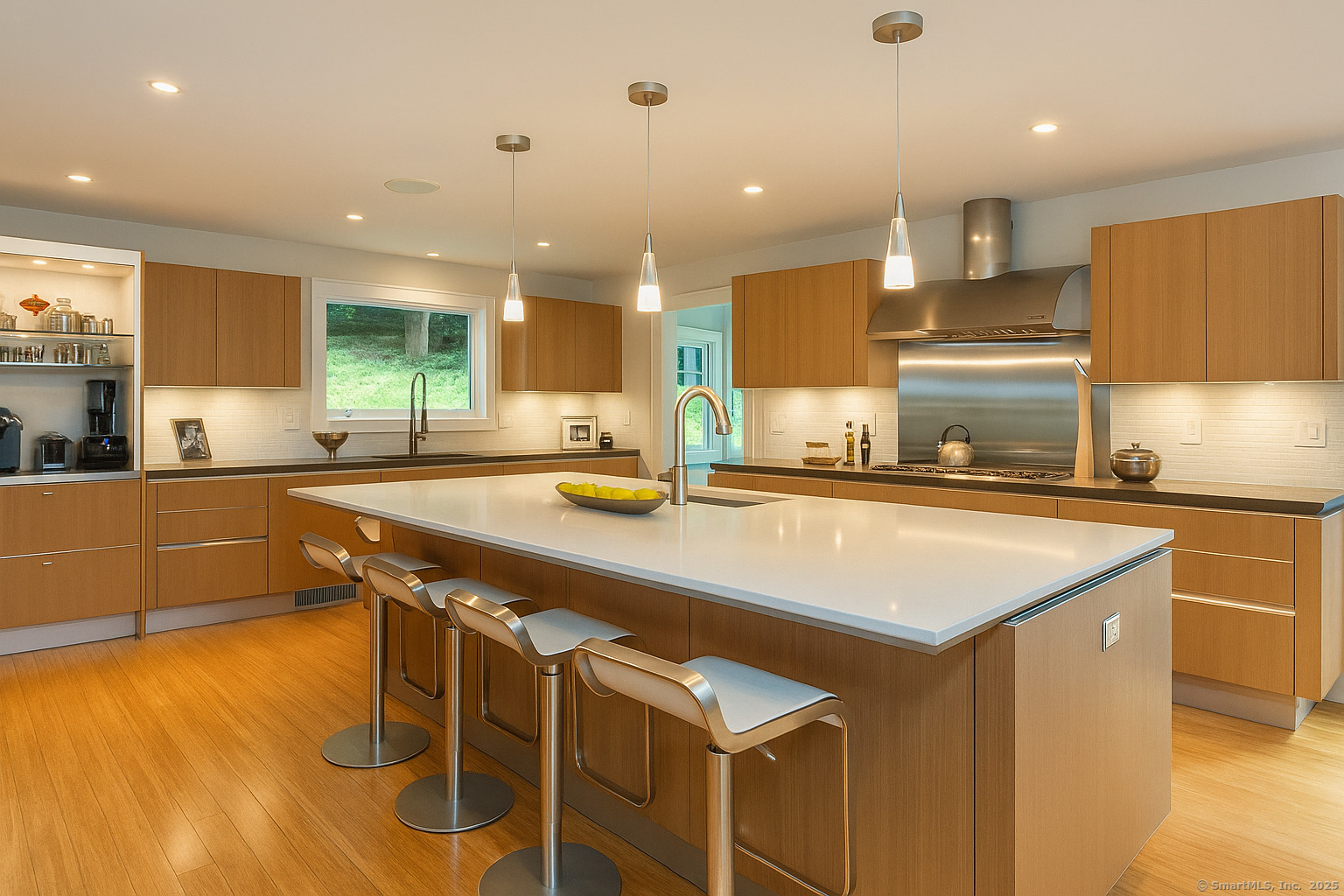 a kitchen with stainless steel appliances granite countertop a sink and a stove