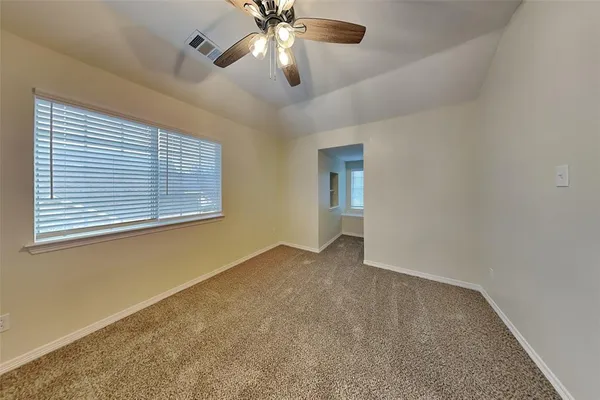 a view of an empty room with a window