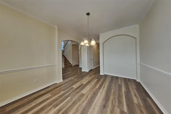 a view of a livingroom with wooden floor