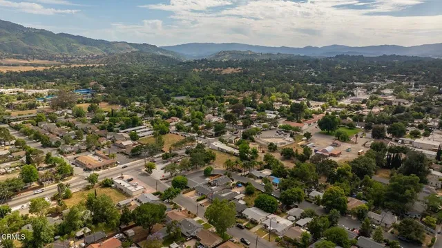 a view of a city with mountains in the background