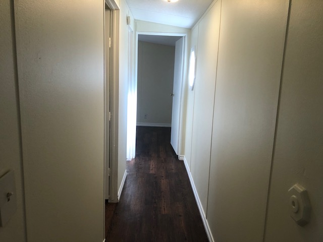 302 North Burnet Street Bremond, TX 76629 - Photo 14 of 41 a view of a hallway with wooden floor