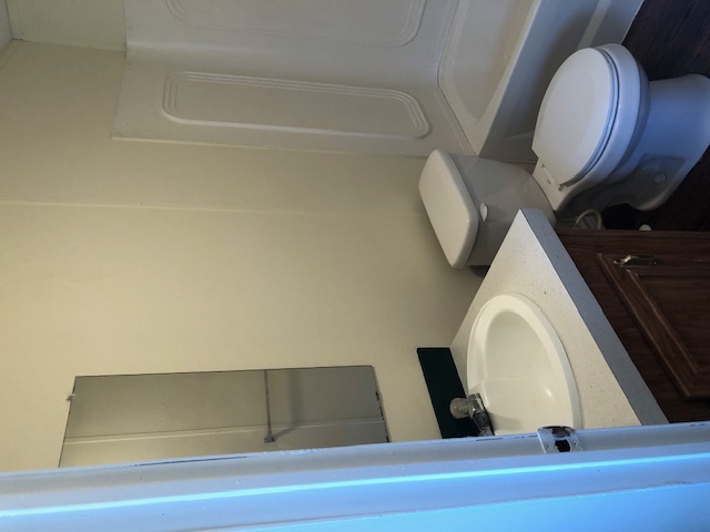 302 North Burnet Street Bremond, TX 76629 - Photo 18 of 41 a bathroom with a sink a toilet and vanity