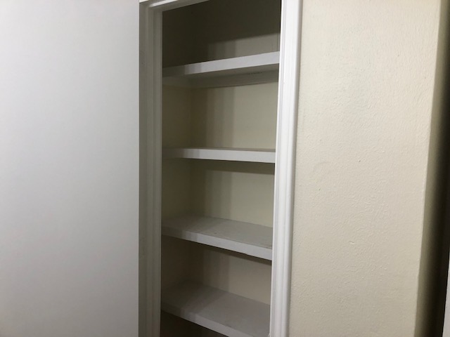 302 North Burnet Street Bremond, TX 76629 - Photo 25 of 41 a view of an empty walk in closet