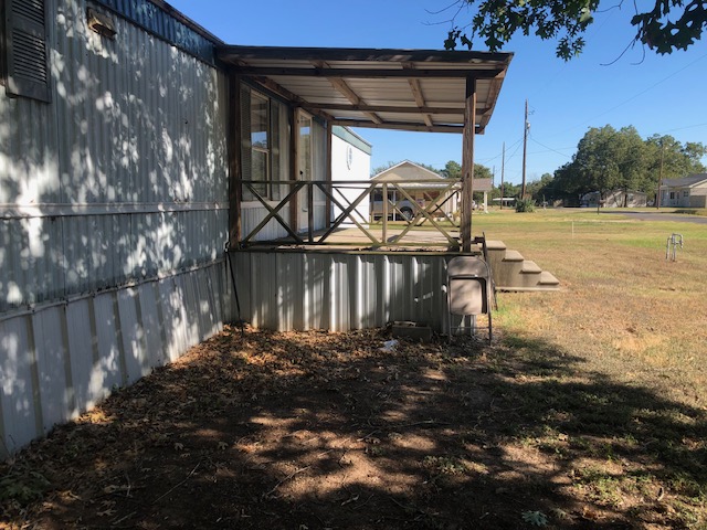 302 North Burnet Street Bremond, TX 76629 - Photo 6 of 41 a view of a yard with wooden fence