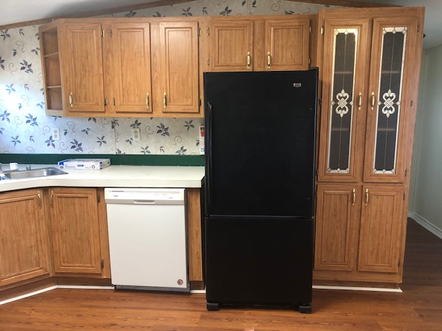 302 North Burnet Street Bremond, TX 76629 - Photo 10 of 41 a view of cabinets and wooden floor