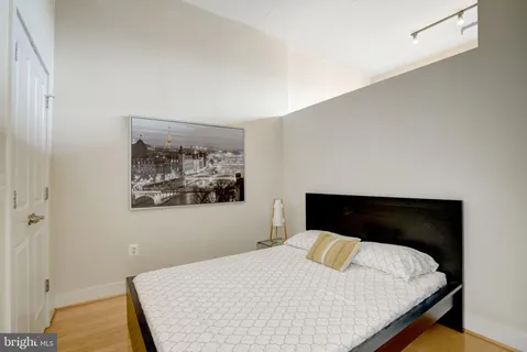 a bedroom with a bed and a table