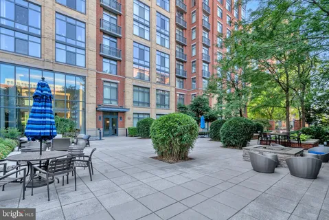 a view of swimming pool with outdoor seating