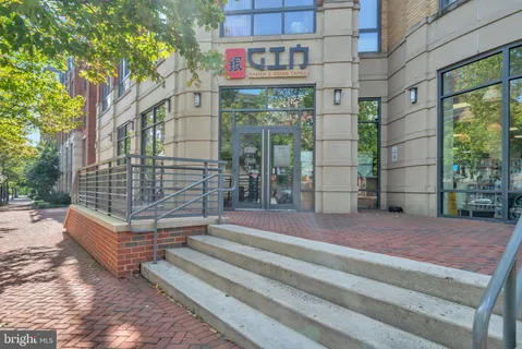 a view of a building with sitting area