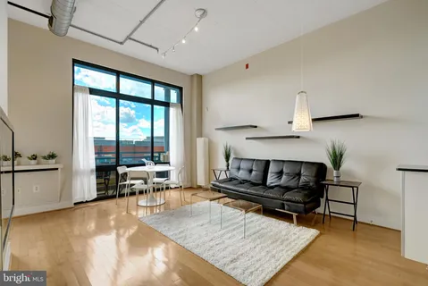 a view of a room with a table and chairs