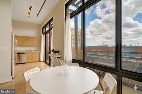 a kitchen with stainless steel appliances a refrigerator sink and stove