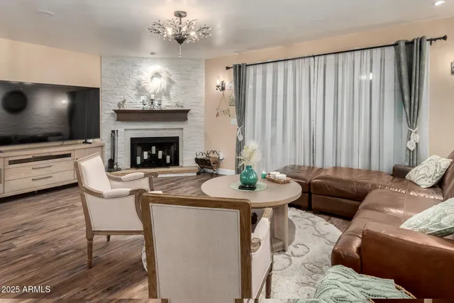 a dining room with furniture and wooden floor