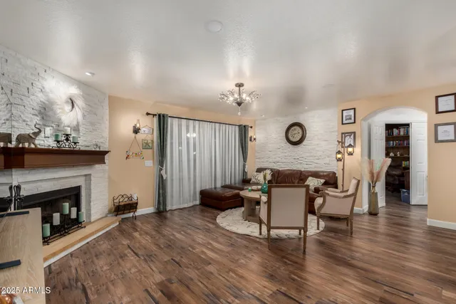 a dining room with furniture and wooden floor