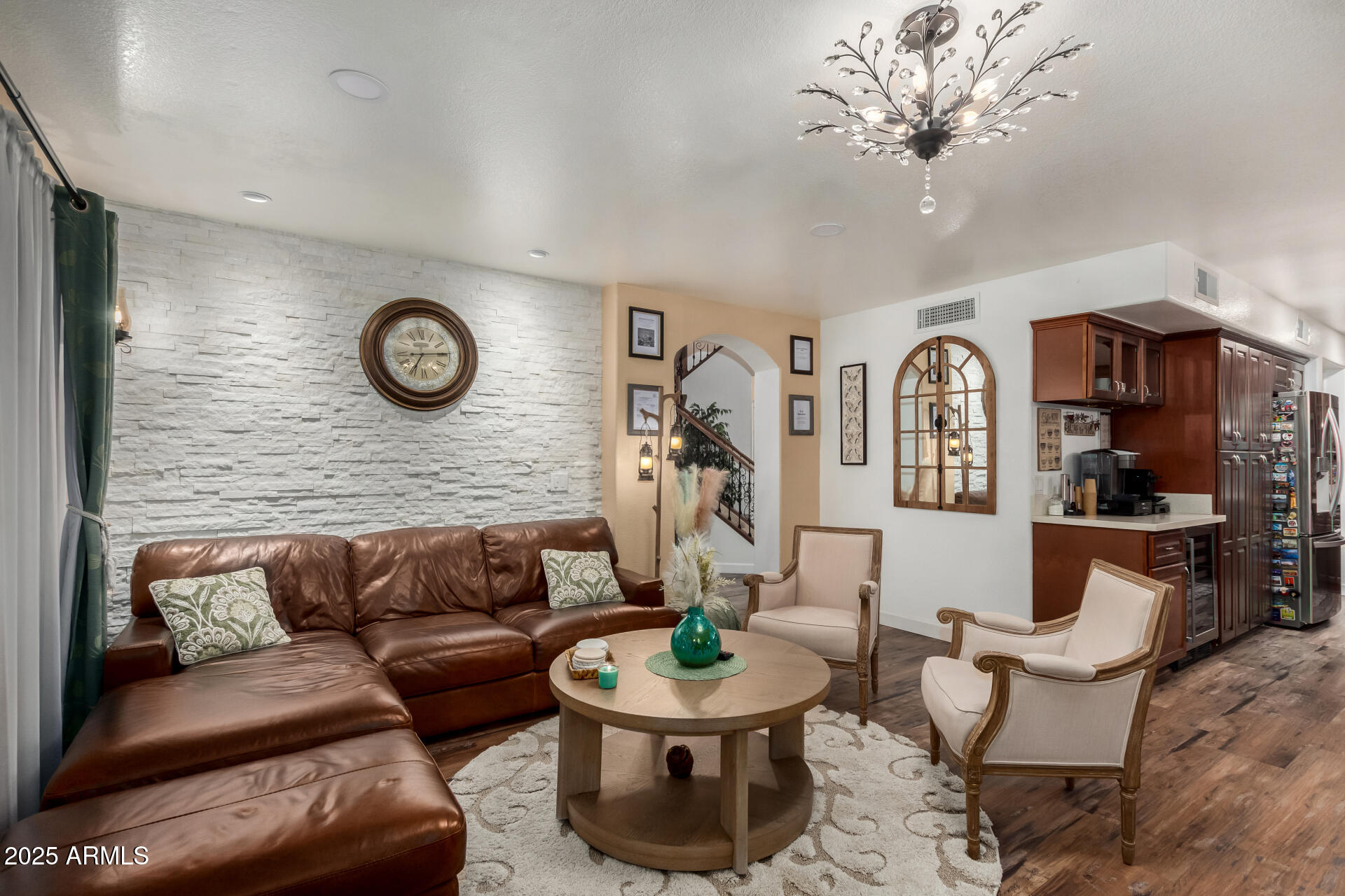 5956 East Phelps Road Scottsdale, AZ 85254 - Photo 15 of 60 a living room with furniture a clock and a large mirror
