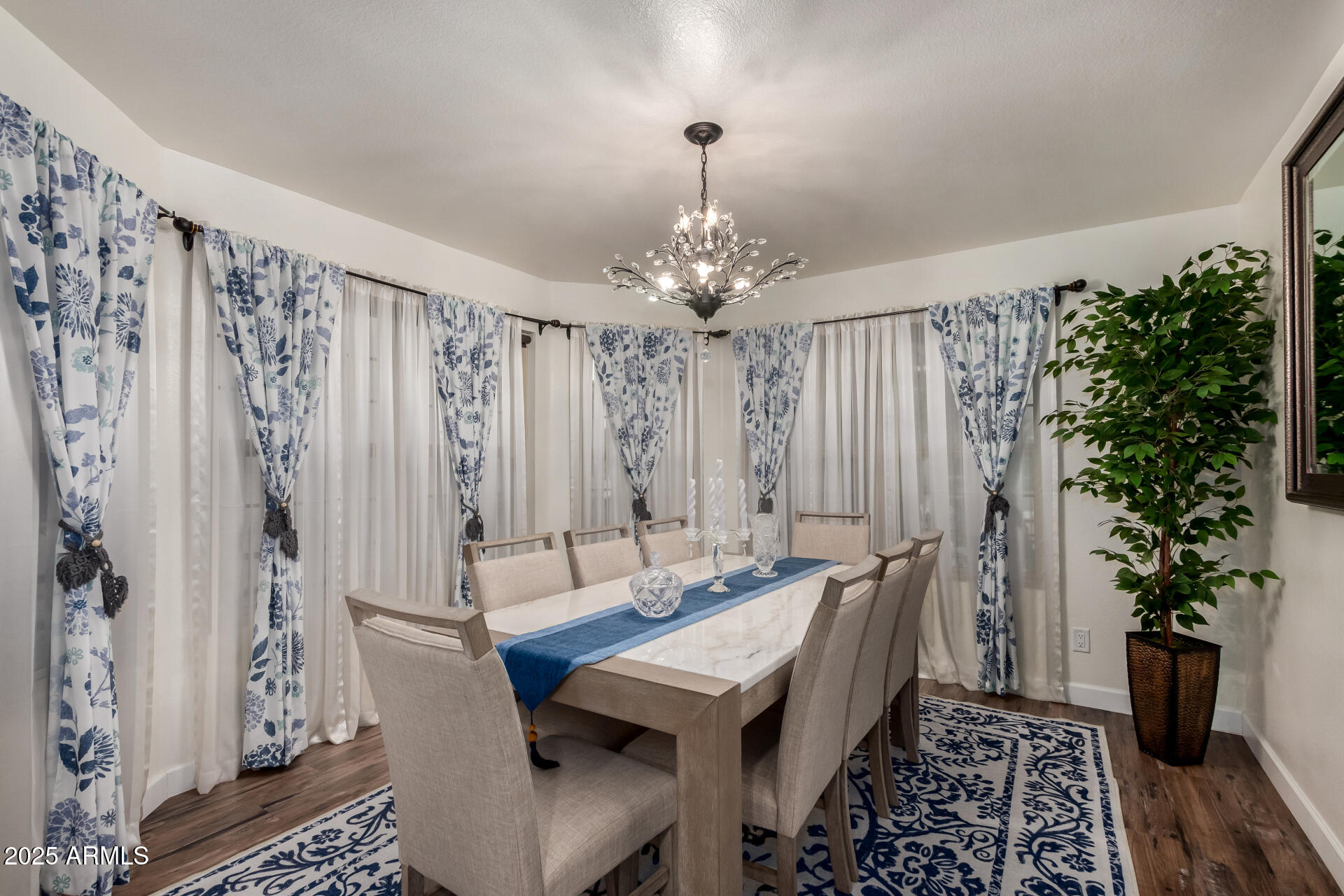 5956 East Phelps Road Scottsdale, AZ 85254 - Photo 16 of 60 a dining room with furniture and wooden floor