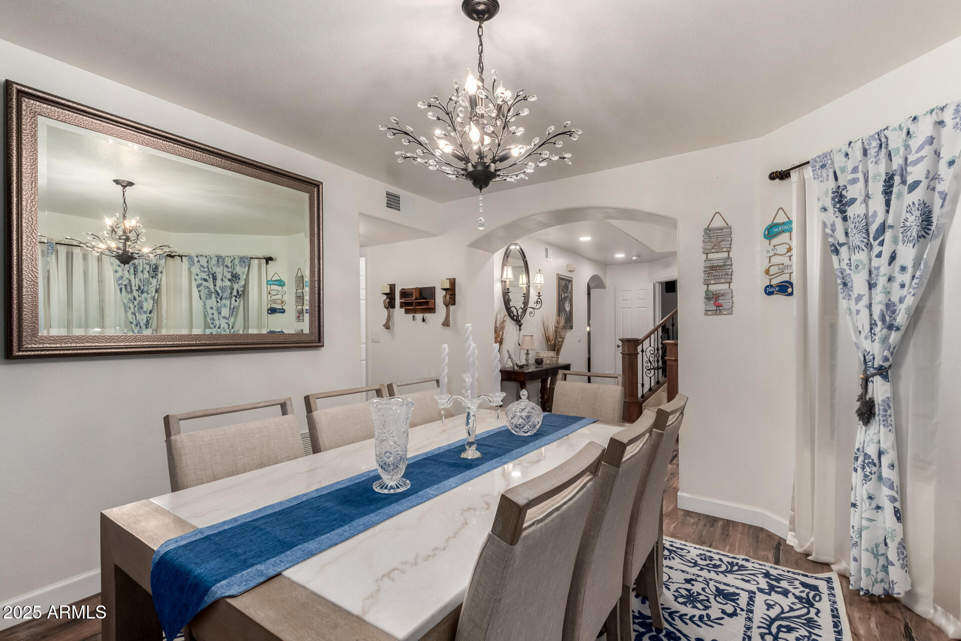 5956 East Phelps Road Scottsdale, AZ 85254 - Photo 17 of 60 a living room with furniture and a chandelier