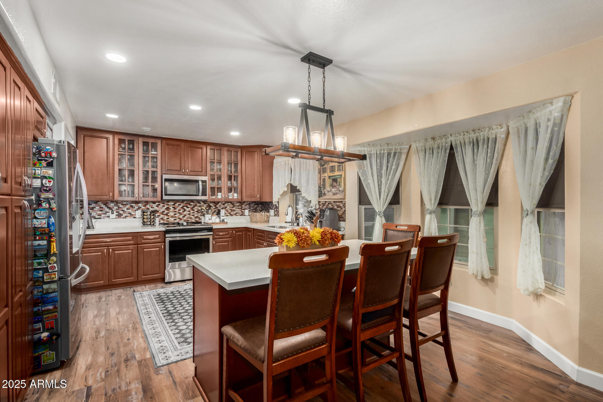 5956 East Phelps Road Scottsdale, AZ 85254 - Photo 18 of 60 a large kitchen with a table and chairs