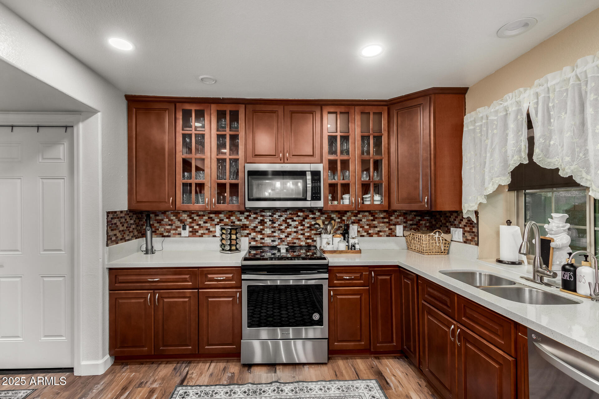 5956 East Phelps Road Scottsdale, AZ 85254 - Photo 22 of 60 a kitchen with stainless steel appliances granite countertop a sink stove and cabinets