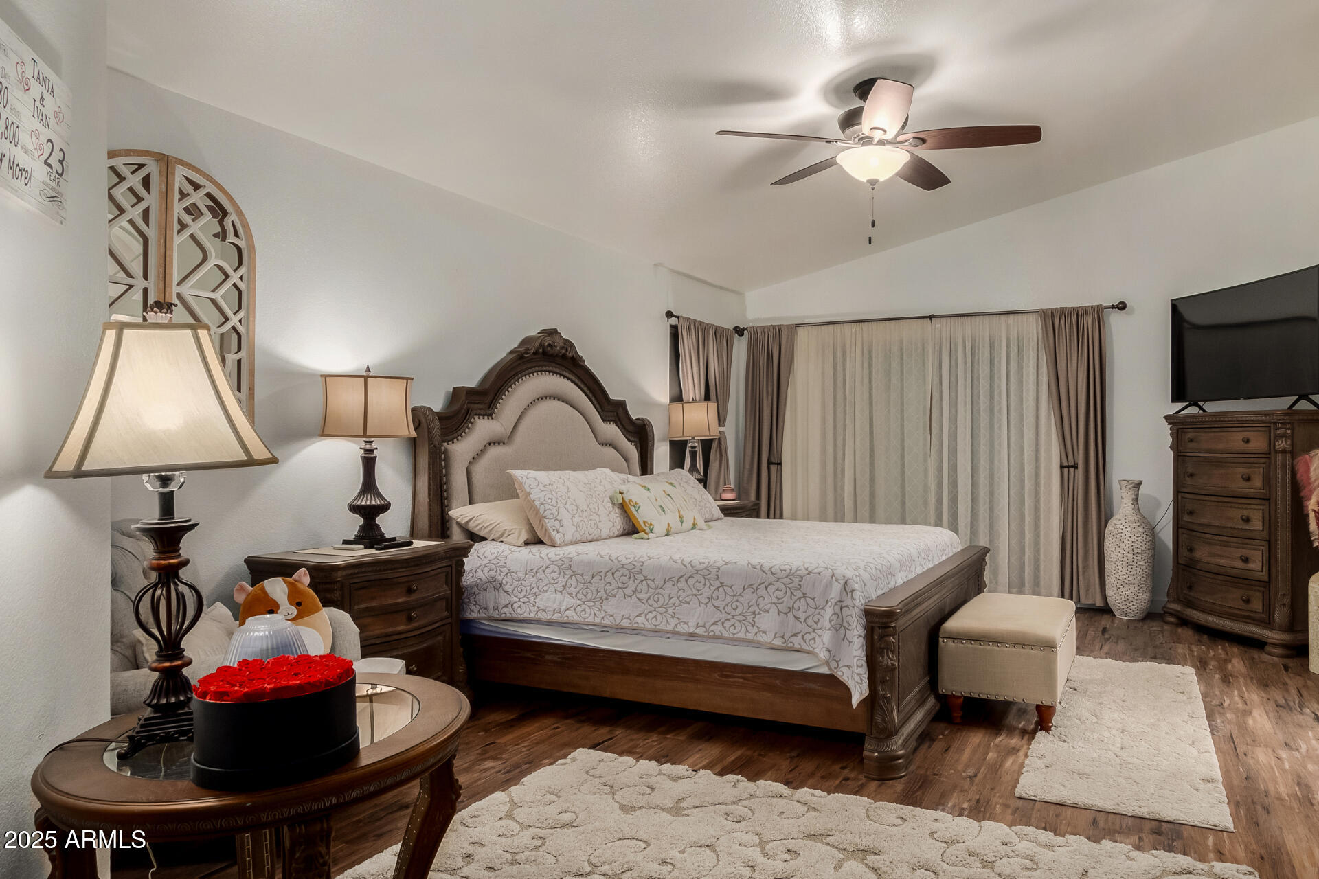 5956 East Phelps Road Scottsdale, AZ 85254 - Photo 24 of 60 a bedroom with a bed and a chandelier