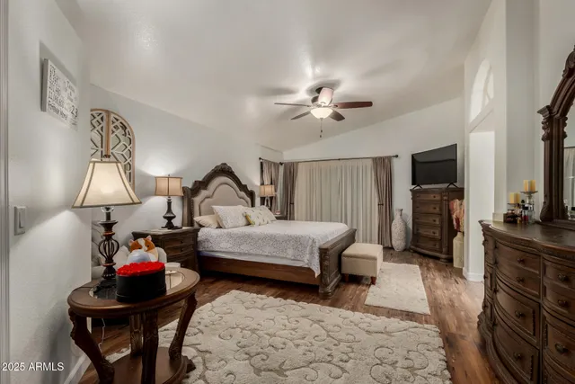 a bathroom with a double vanity sink a mirror and a bathtub