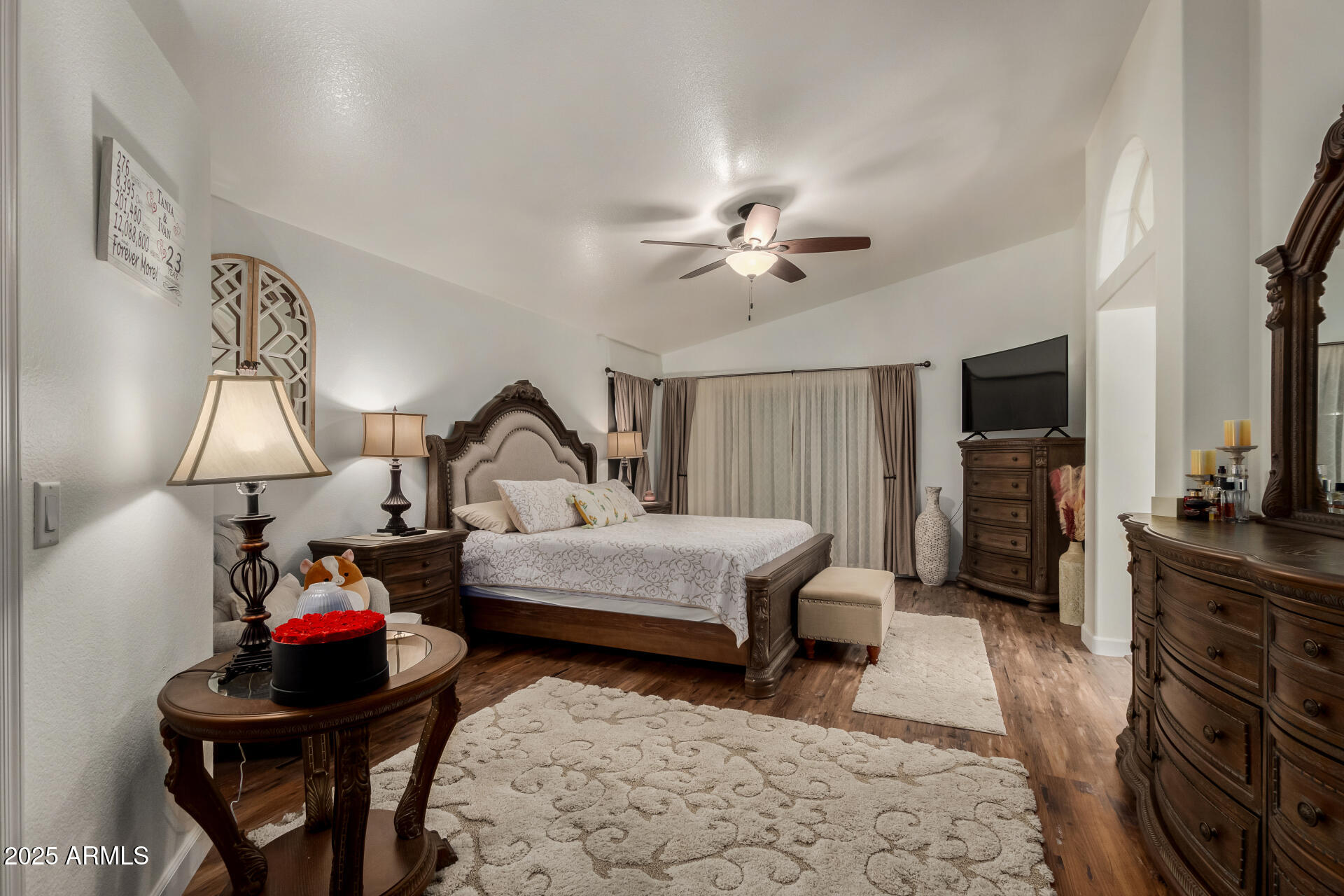 5956 East Phelps Road Scottsdale, AZ 85254 - Photo 25 of 60 a living room with furniture a flat screen tv and a lamp