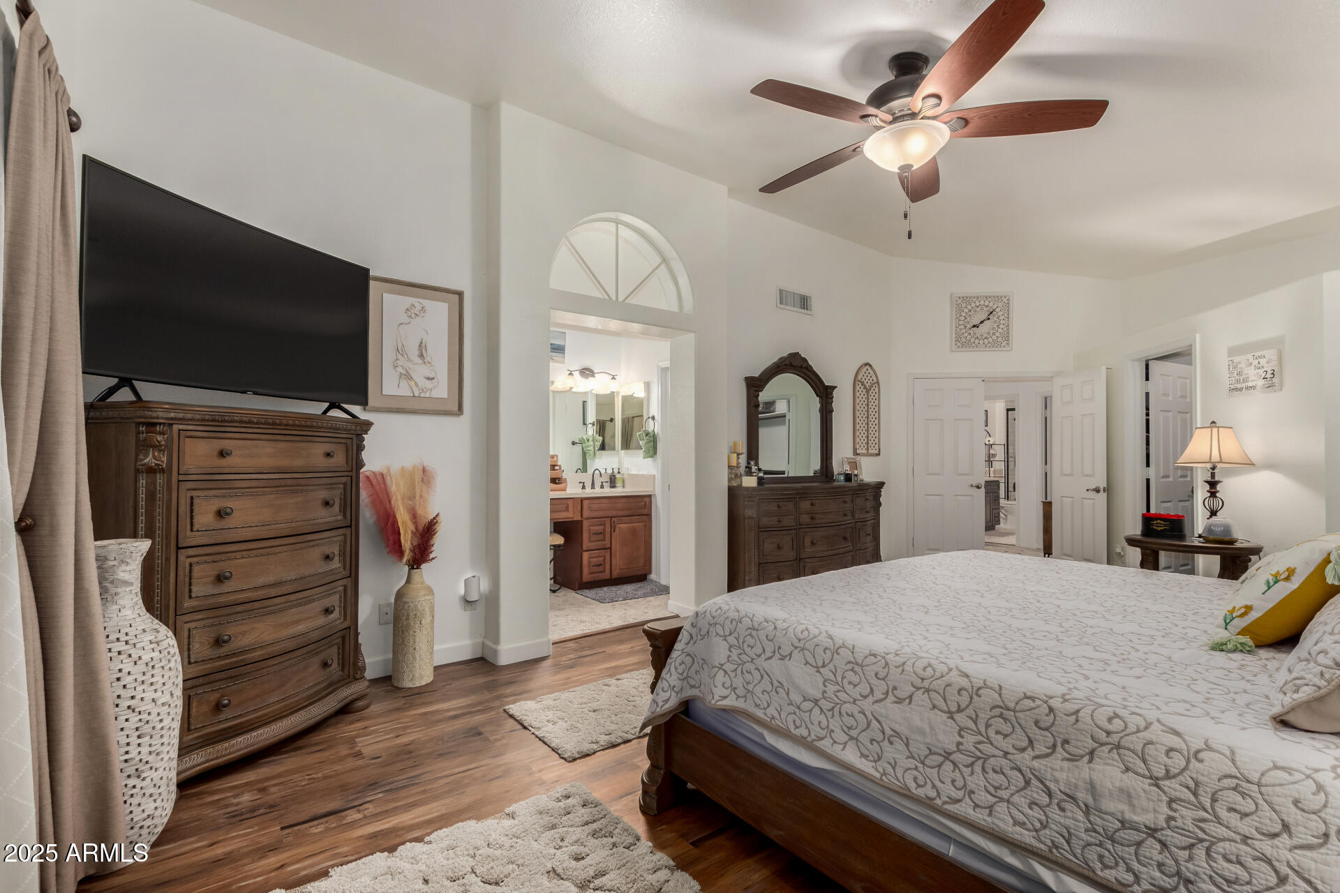 5956 East Phelps Road Scottsdale, AZ 85254 - Photo 26 of 60 a bedroom with a bed and a flat screen tv