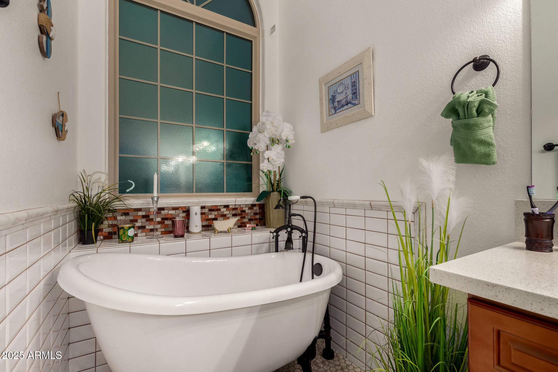 5956 East Phelps Road Scottsdale, AZ 85254 - Photo 29 of 60 a bathroom with a sink and a mirror