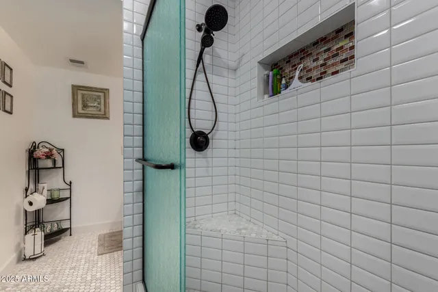 a bedroom with a bed and a television