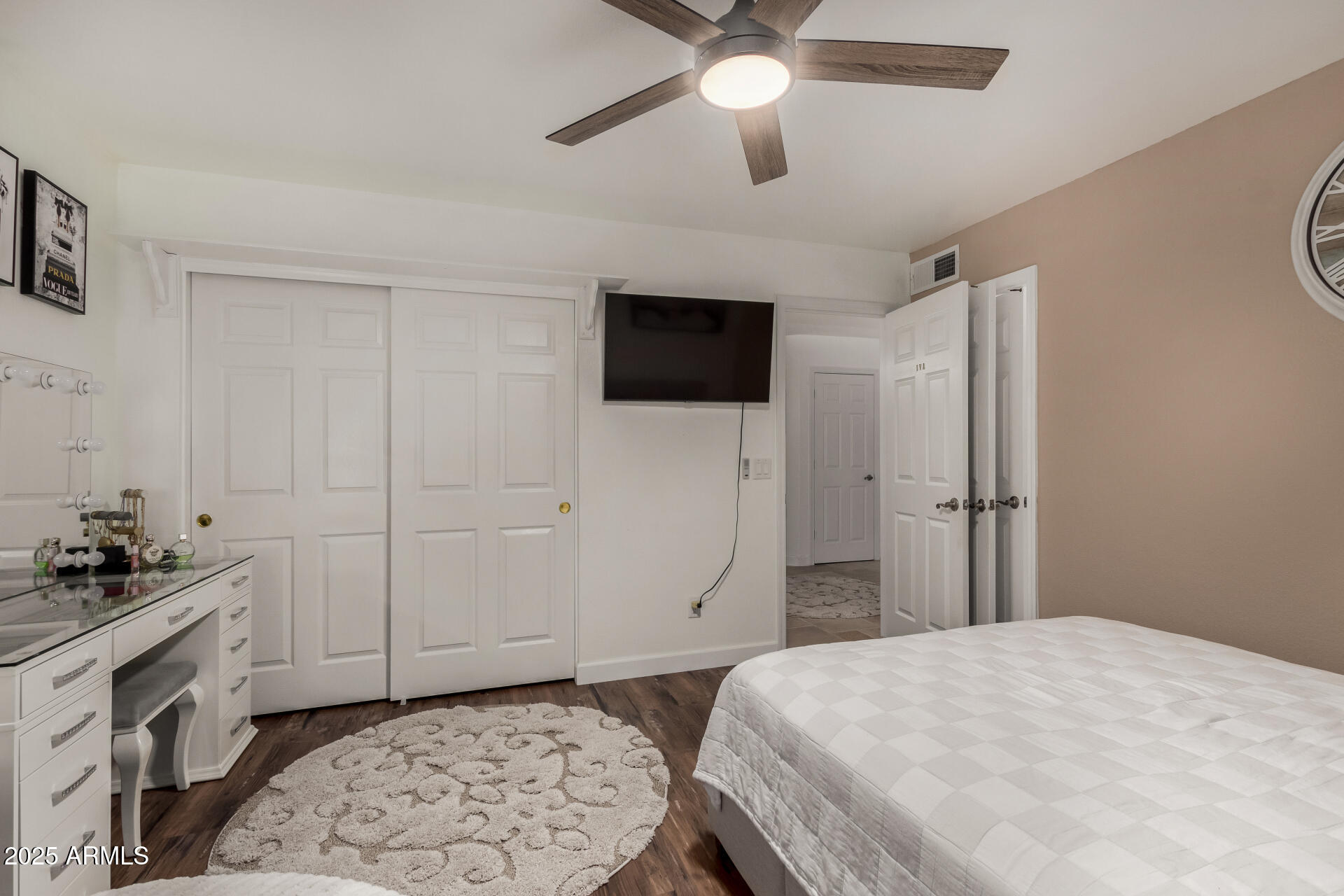 5956 East Phelps Road Scottsdale, AZ 85254 - Photo 34 of 60 a bedroom with a bed and a television