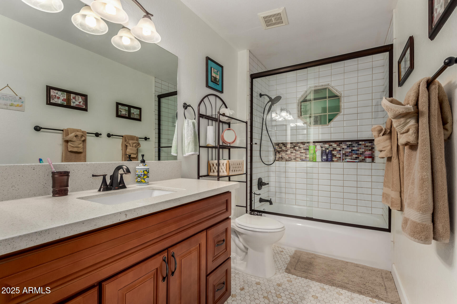 5956 East Phelps Road Scottsdale, AZ 85254 - Photo 35 of 60 a bathroom with a sink a mirror and a shower