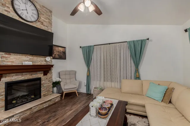 a view of a workspace with furniture and a bookshelf