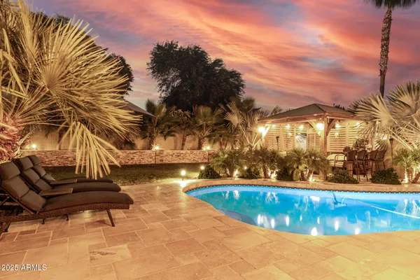 a view of a swimming pool with a patio