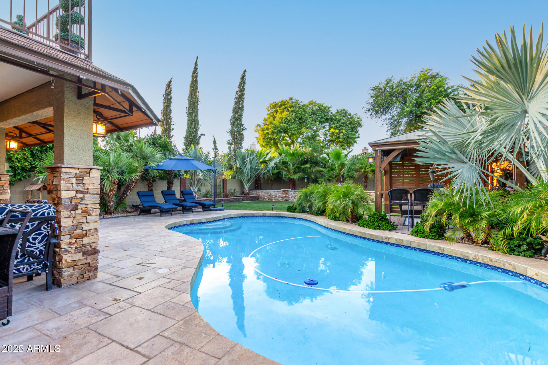 5956 East Phelps Road Scottsdale, AZ 85254 - Photo 53 of 60 a view of a swimming pool with a patio