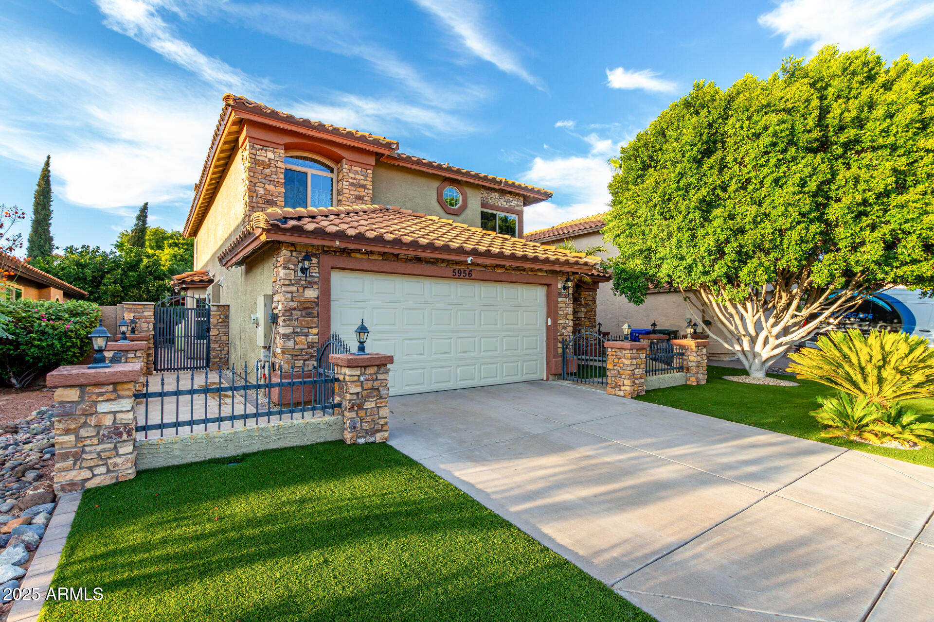 5956 East Phelps Road Scottsdale, AZ 85254 - Photo 6 of 60 a front view of a house with garden